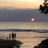 A family enjoying the sunset at Nang Thong beach Khao lak, Thailand